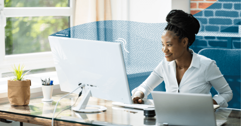 Woman sitting at desk using a computer for customer support - Customer Support: Definition and Strategies for Success