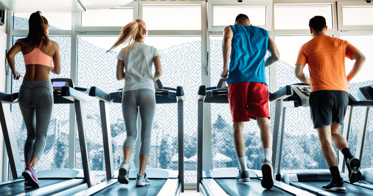 gym members running on treadmill - Maximize Your Gym's New Year Promotions with Text Messaging