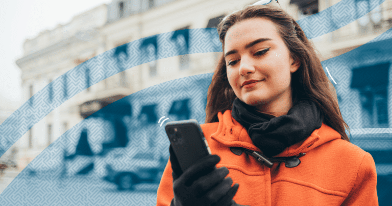 Woman standing outside and texting - What You Need to Know about TCPA’s Opt-In and Opt-Out Requirements